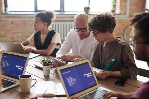 diversity in a work environment or office, people working in an office with laptops