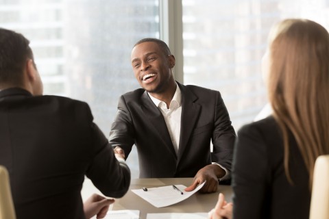 black man shaking hands to man after accepting job offered during the hiring process